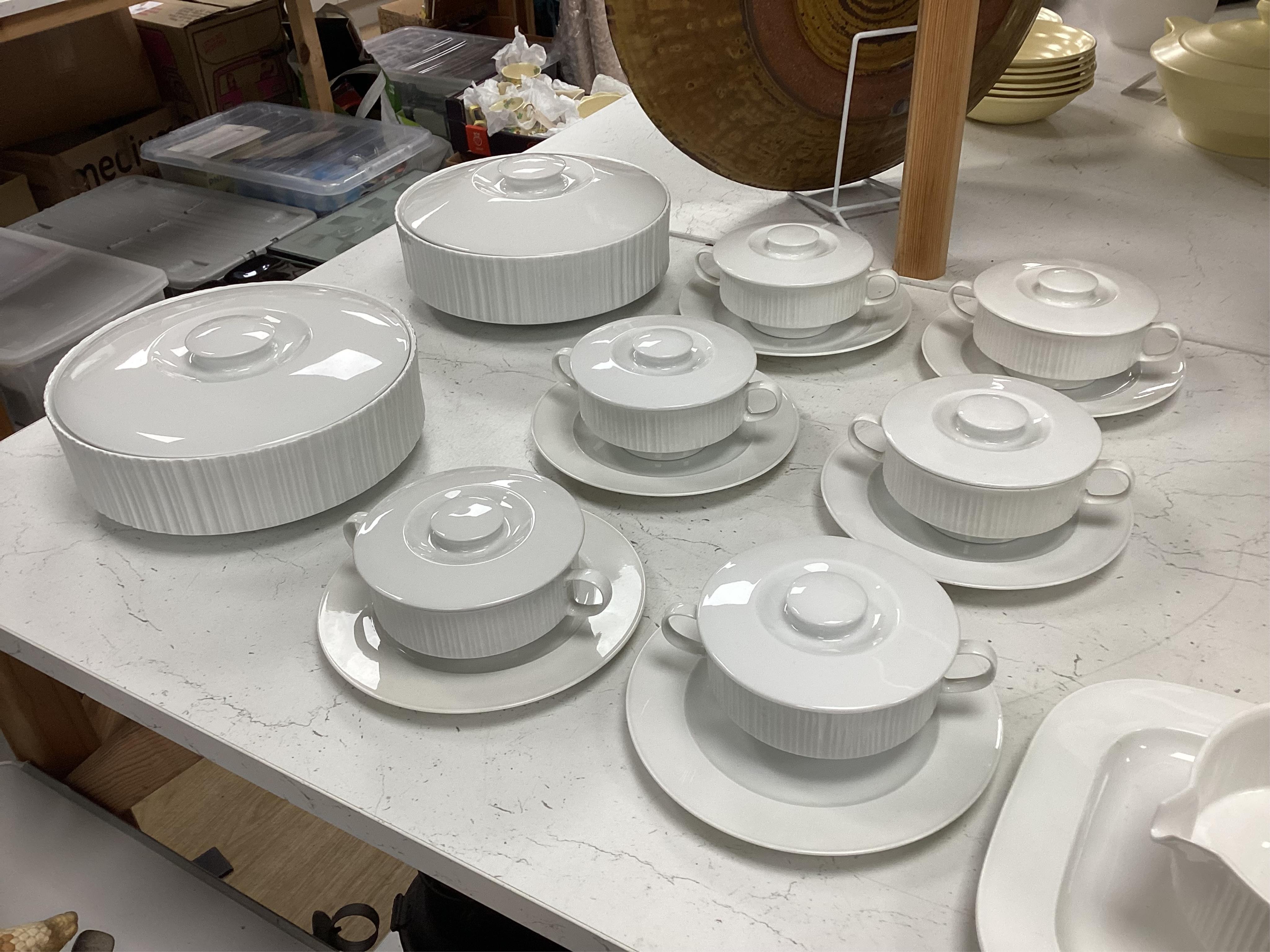 A Wirkkala for Rosenthal part dinner set to include a set of dinner plates, two tureens and six ruby glass bowls, largest 33cm in diameter